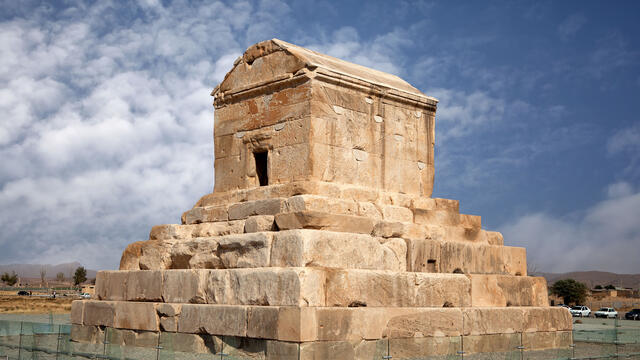 Tomb of Cyrus Photograph of stone tomb on top of tiered platform.