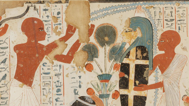 Mourning Activities Mural of crouching woman with hand on her head next to upright mummy held up by figure in tunic, as another figure in tunic raises arms above woman, with hieroglyphic text in background.