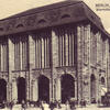 Postcard depicting exterior of building with many columns built into its walls.